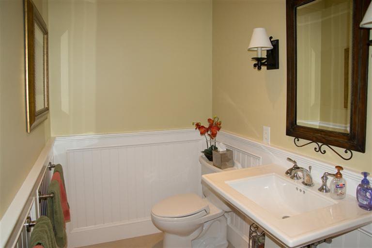 429 Monomoscoy Road Mashpee, MA 02649 - Photo 20 of 26 a bathroom with a sink toilet and vanity