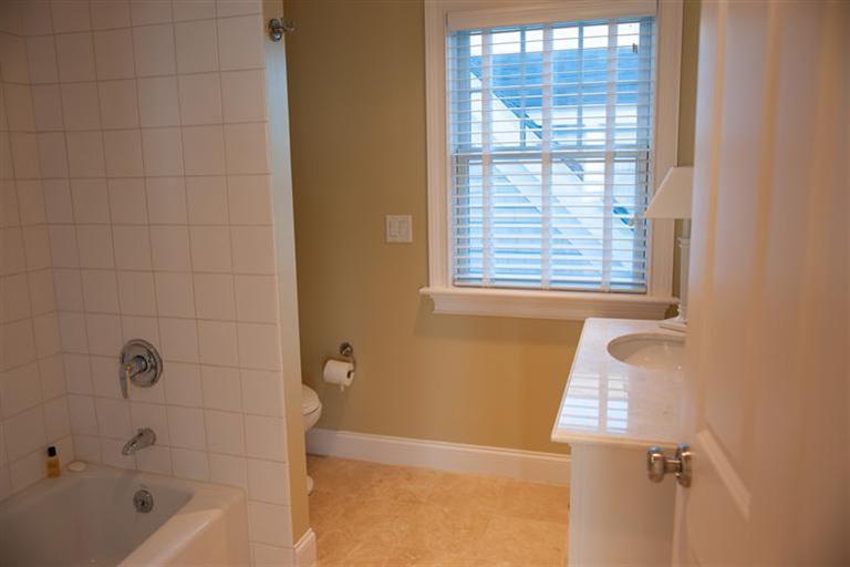 429 Monomoscoy Road Mashpee, MA 02649 - Photo 23 of 26 a bathroom with a bathtub