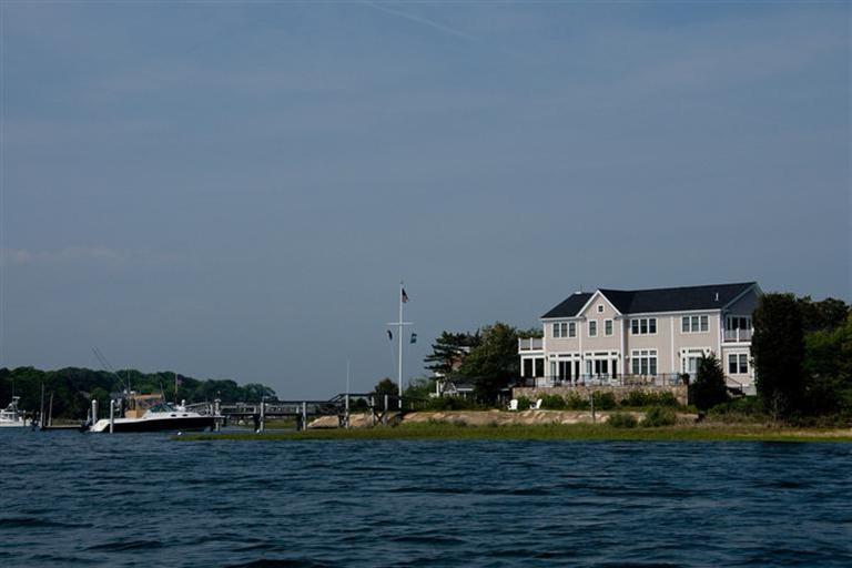 429 Monomoscoy Road Mashpee, MA 02649 - Photo 3 of 26 a front view of a house with a yard