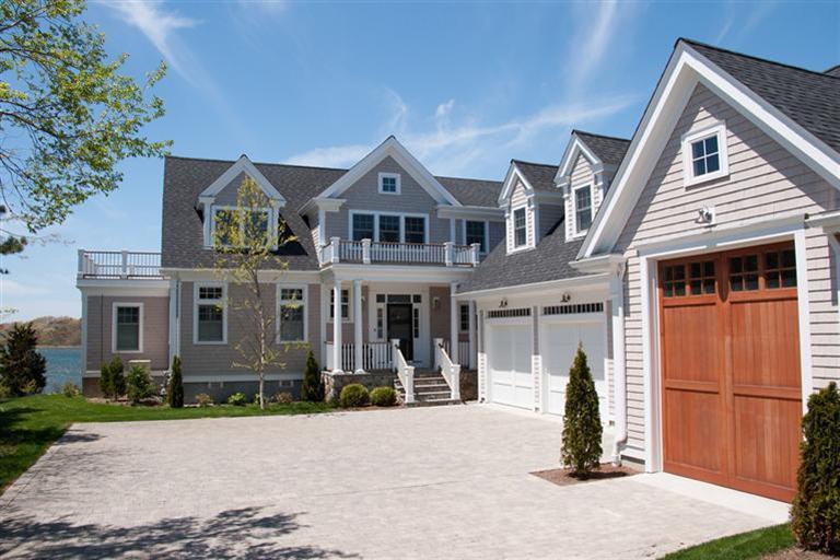 429 Monomoscoy Road Mashpee, MA 02649 - Photo 5 of 26 a front view of a house with a yard