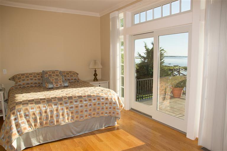 429 Monomoscoy Road Mashpee, MA 02649 - Photo 9 of 26 a bedroom with a bed and window