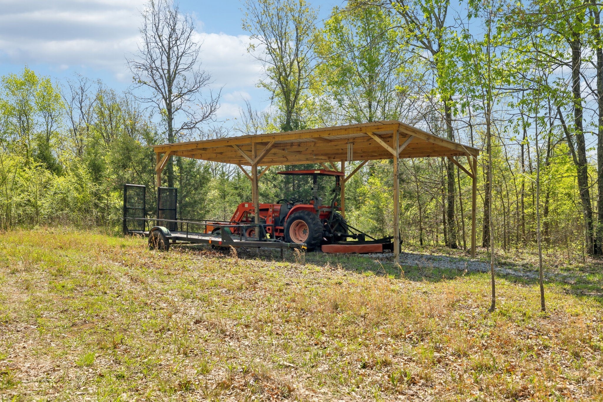 1716 South Berlin Road Lewisburg, TN 37091 - Photo 15 of 78 a view of a backyard with table and chairs under an umbrella