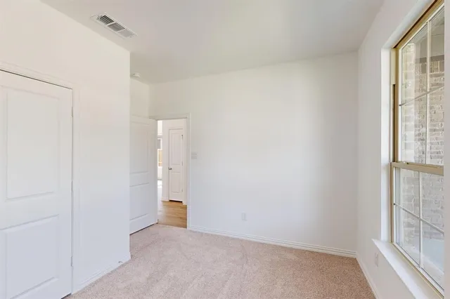 a view of an empty room and window