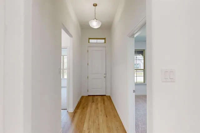 a view of livingroom with chandelier fan