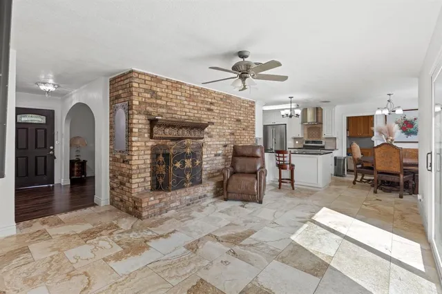 a view of a livingroom with furniture and a kitchen