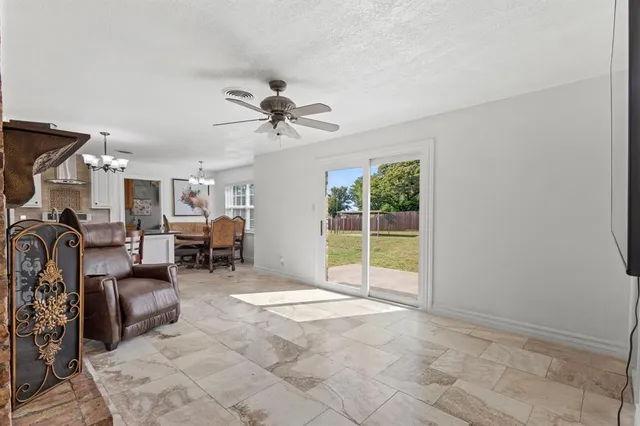 a view of a livingroom with furniture and a flat screen tv