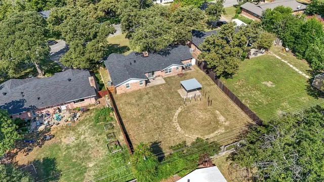 an aerial view of residential house with outdoor space