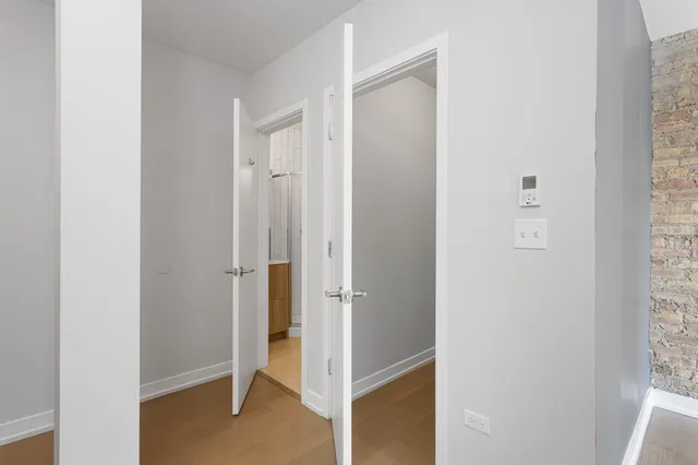 a bathroom with a shower a toilet and sink