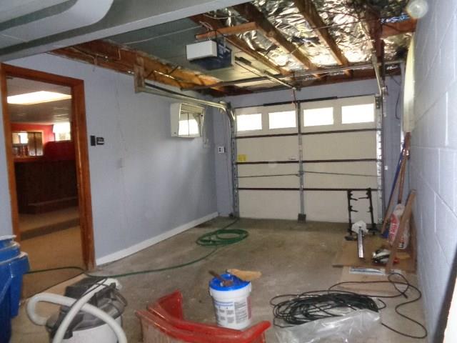 135 Ashbaugh Road Jeannette, PA 15644 - Photo 22 of 25 Extra Deep Garage with Auto Door Opener and Built in shelving/storage.