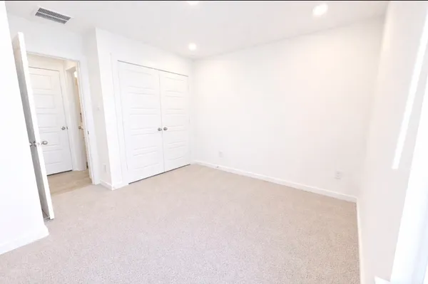 a white bath tub sitting next to a white toilet