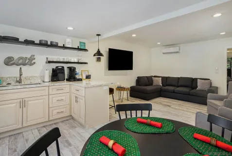 a living room with furniture fireplace and flat screen tv