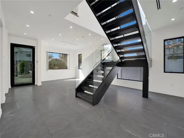 a bathroom with a bathtub shower sink vanity and toilet