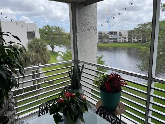 a balcony with a potted plant on it
