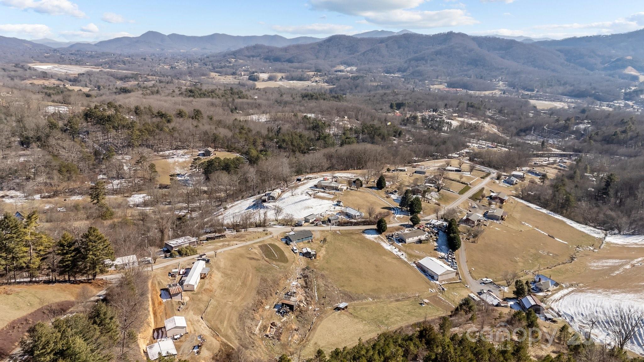 1293 Chambers Mountain Road Clyde, NC 28721 - Photo 26 of 27 an aerial view of a house with a mountain