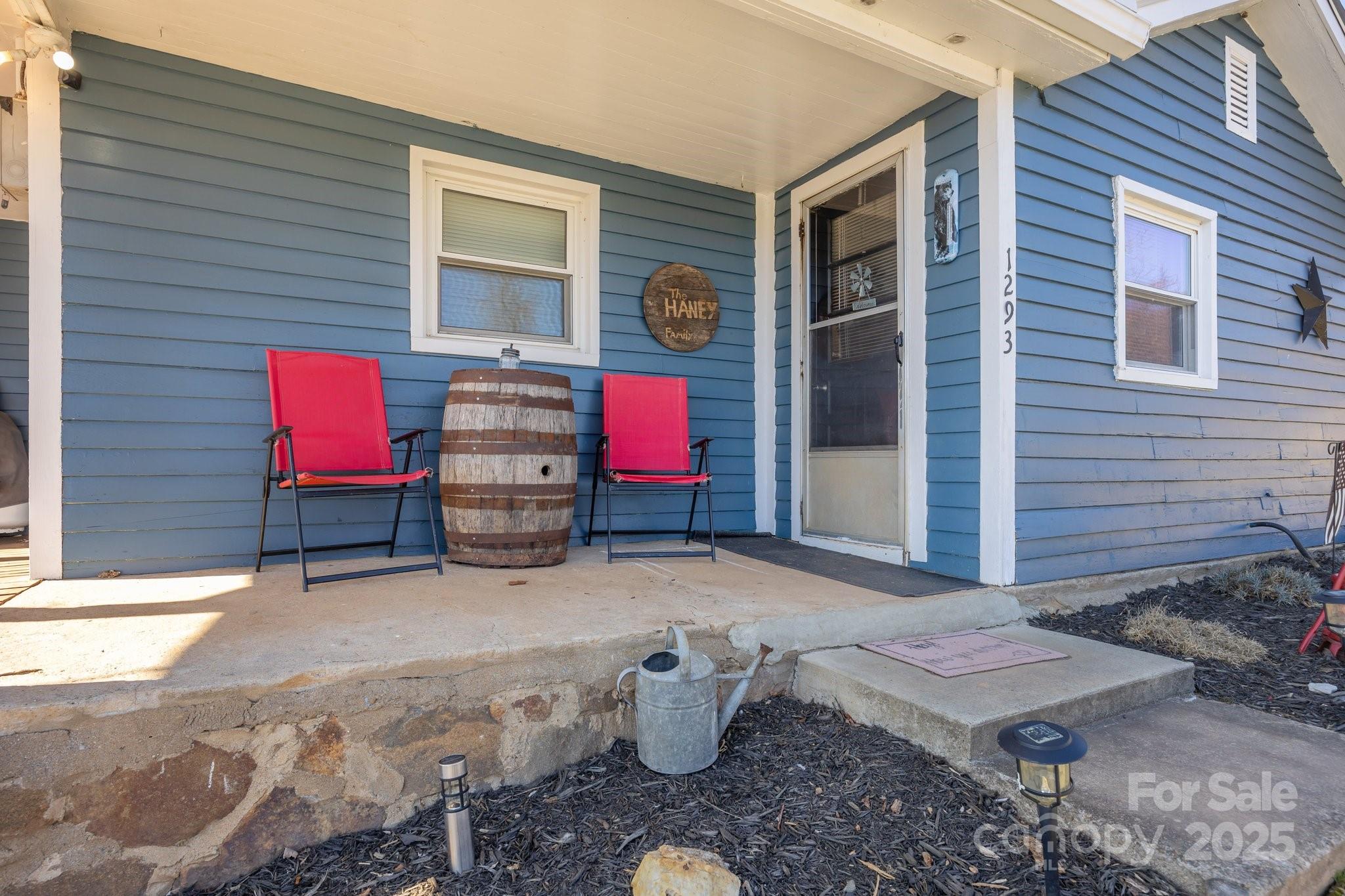 1293 Chambers Mountain Road Clyde, NC 28721 - Photo 3 of 27 a backyard of a house with seating space