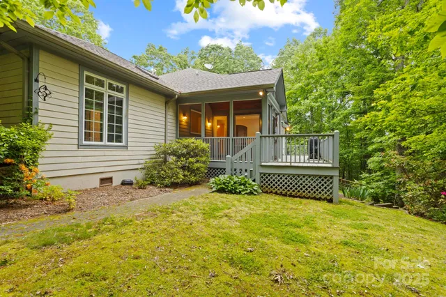 a view of a house with wooden floor and a yard