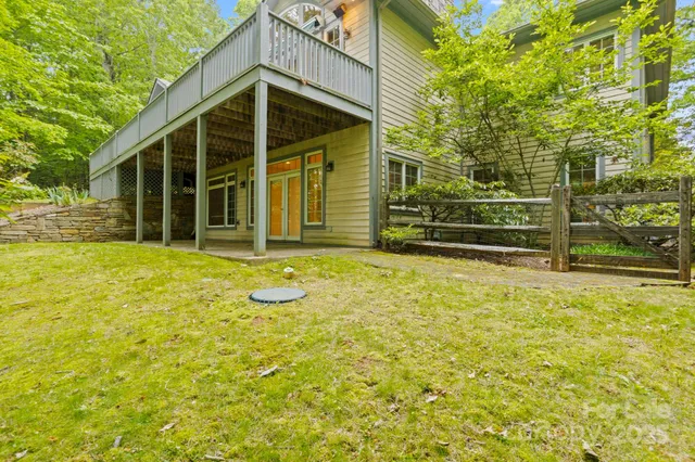 a front view of a house with a yard and a garage