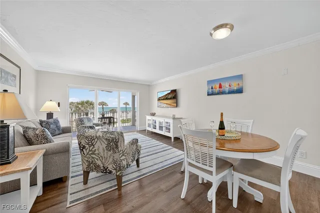 a dining room with furniture and wooden floor