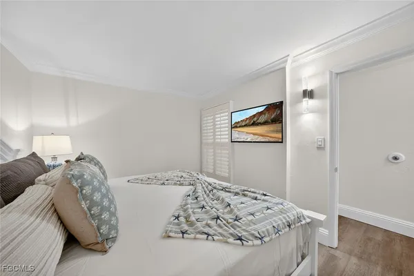 a bathroom with a granite countertop sink a mirror and a bathtub