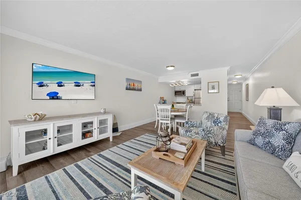 a living room with furniture and a rug