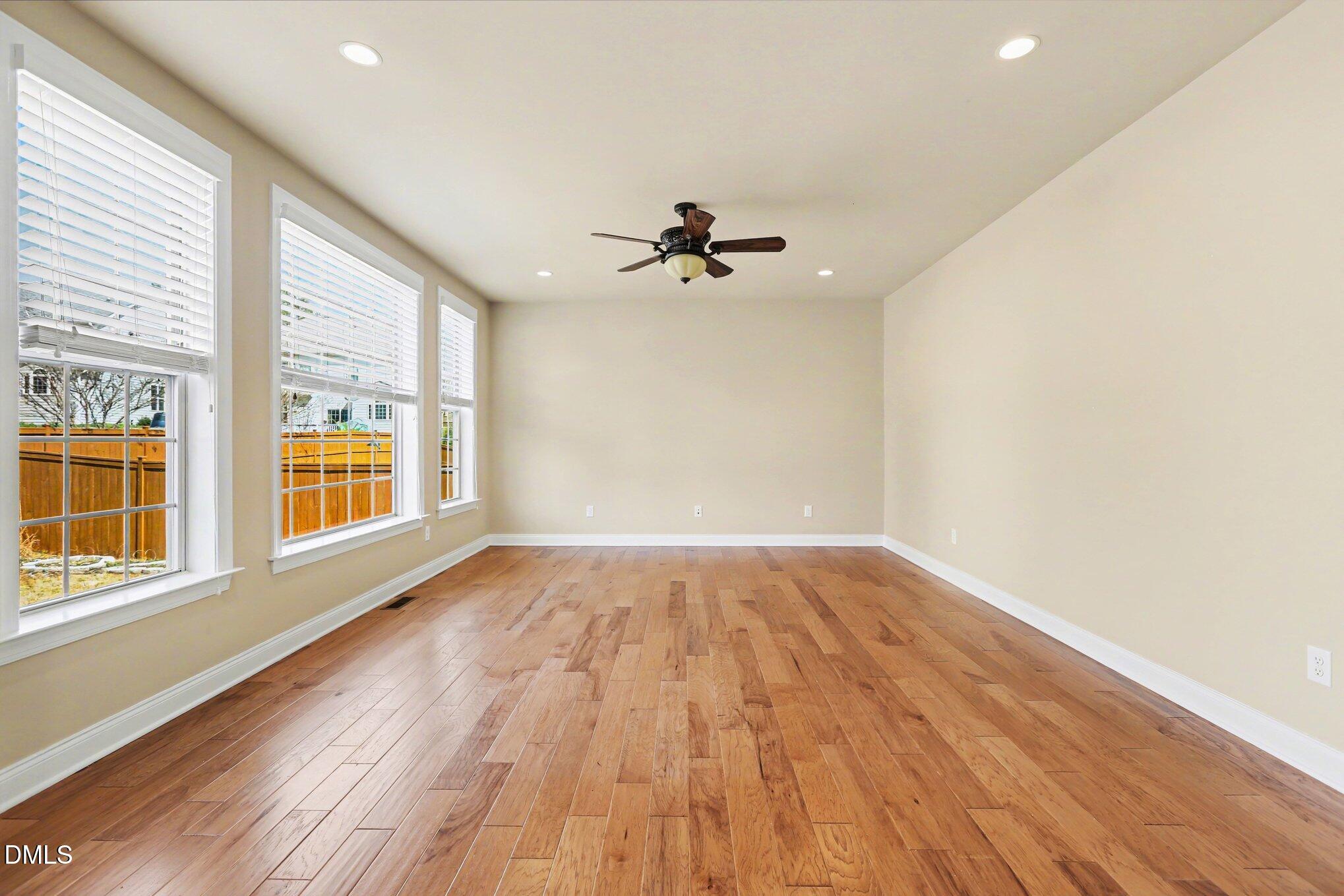351 Gartrell Way Cary, NC 27519 - Photo 16 of 51 wooden floor in an empty room with a window