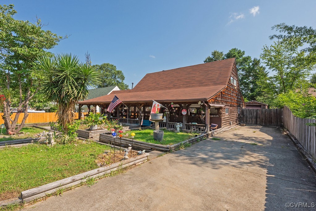 View of front of home with concrete driveway and a