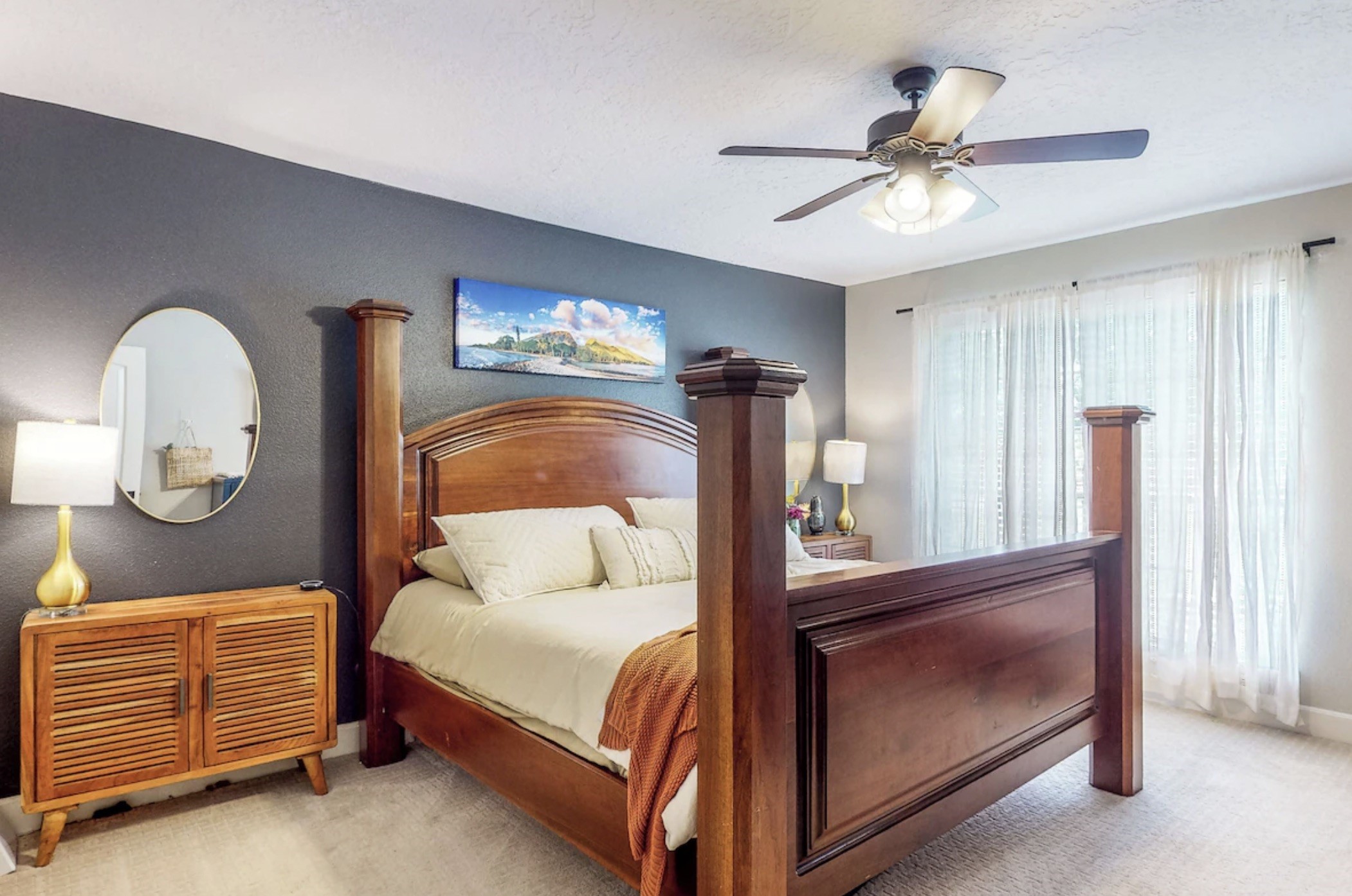 30819 Quinn Road Tomball, TX 77375 - Photo 12 of 30 a bedroom with a bed and a chandelier