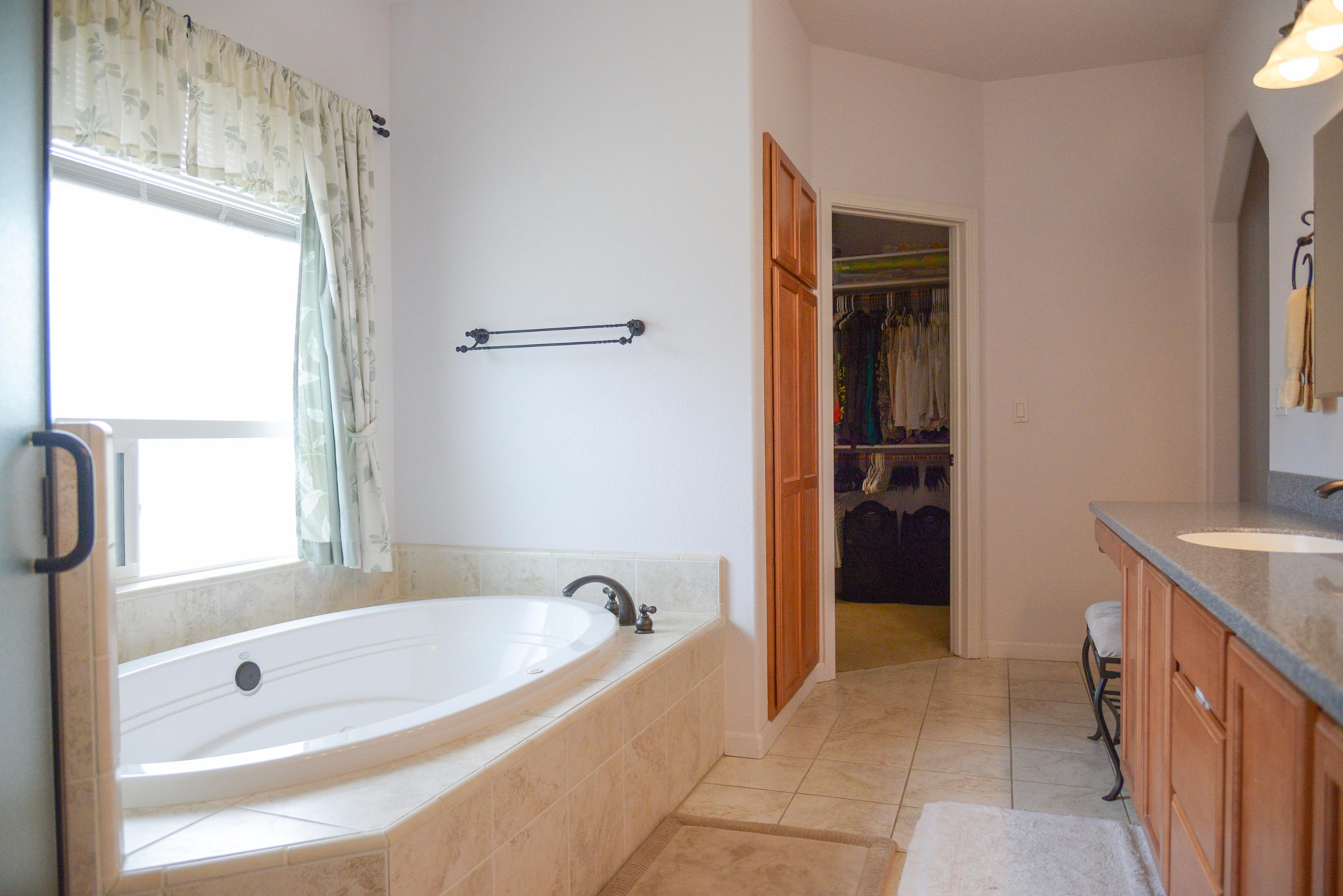 20765 Live Oak Road Red Bluff, CA 96080 - Photo 22 of 30 a bathroom with a tub a sink and a shower