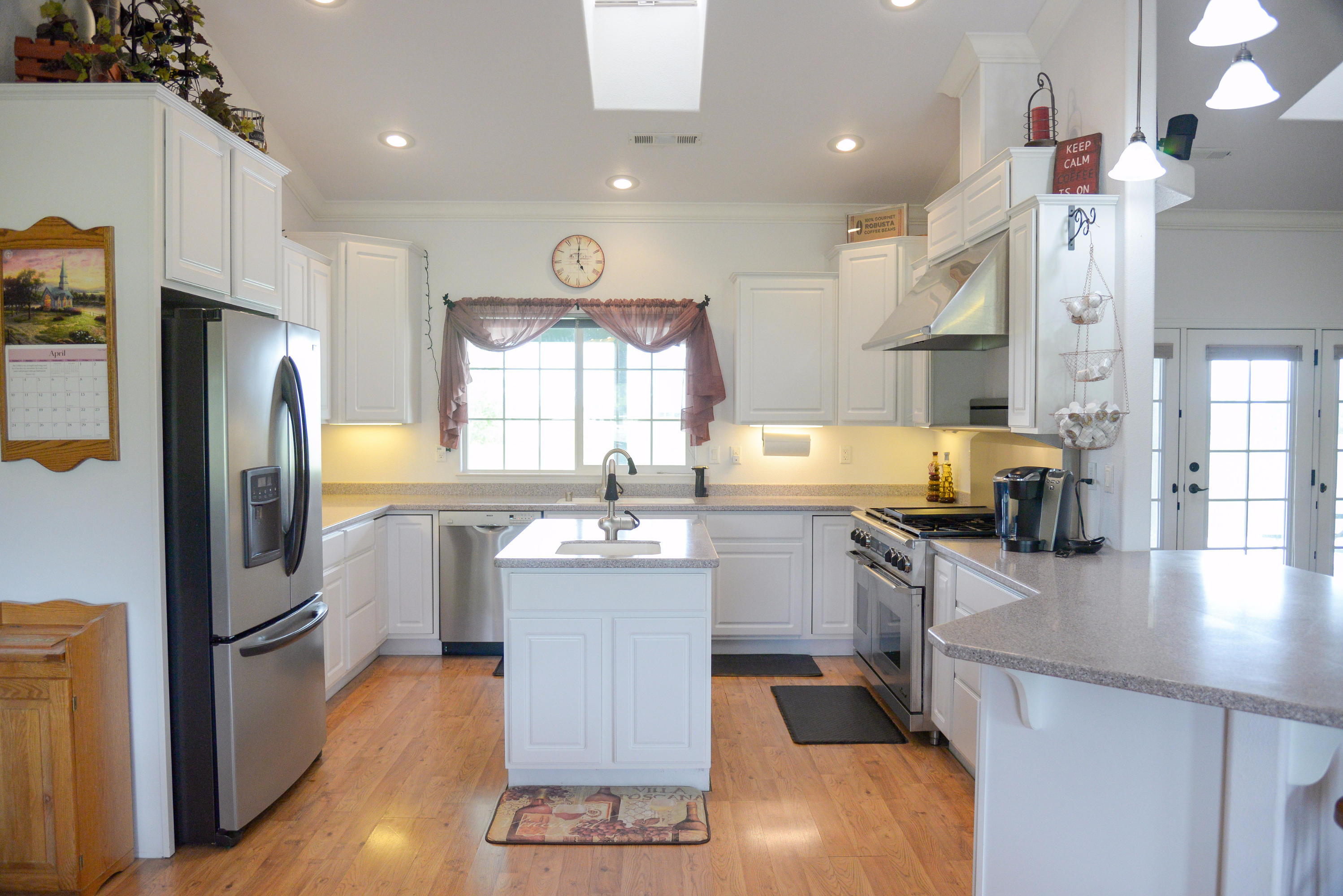 20765 Live Oak Road Red Bluff, CA 96080 - Photo 5 of 30 a kitchen with refrigerator and cabinets