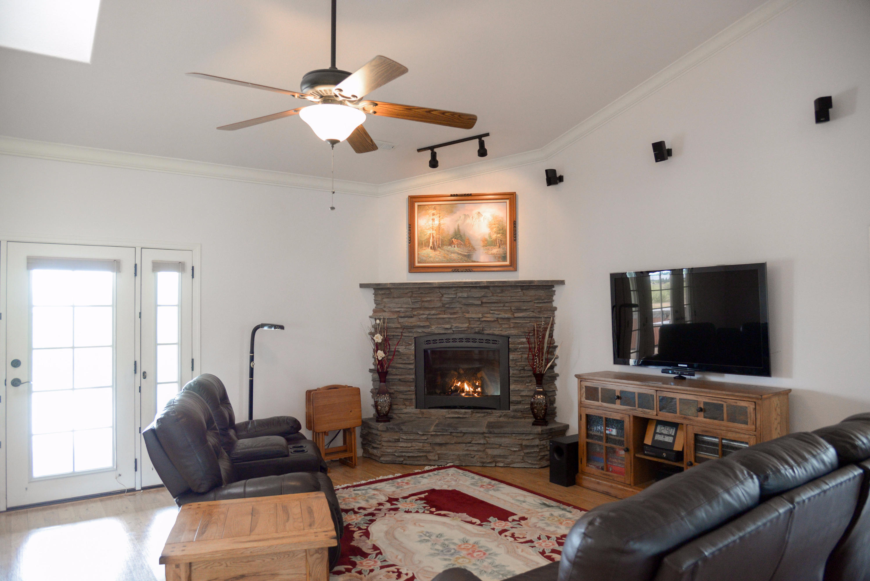 20765 Live Oak Road Red Bluff, CA 96080 - Photo 9 of 30 a living room with furniture and a fireplace