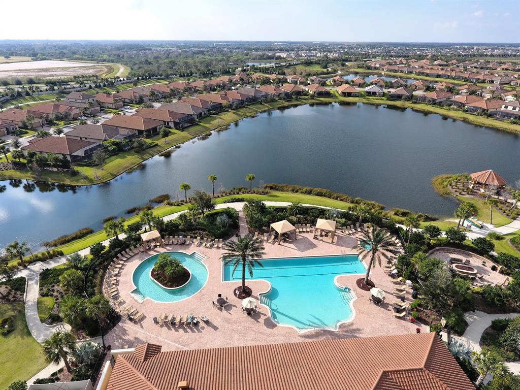 4511 Terrazza Court Lakewood Ranch, FL 34211 - Photo 61 of 65 an aerial view of a house with a swimming pool yard and outdoor seating