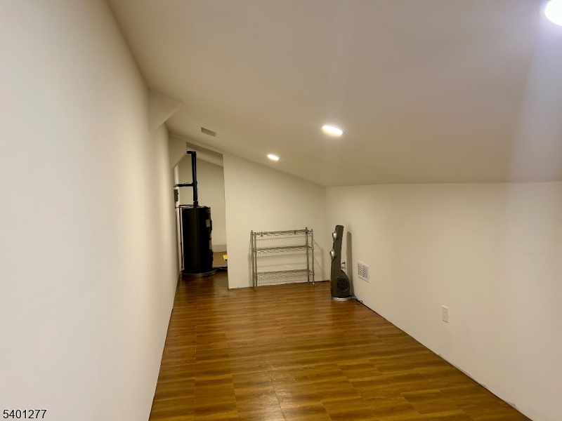 2350 State Route 10, Unit 20 Morris Plains, NJ 07950 - Photo 13 of 13 a view of an empty room with wooden floor