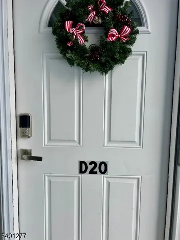 a vase of flowers sitting on a white shelf