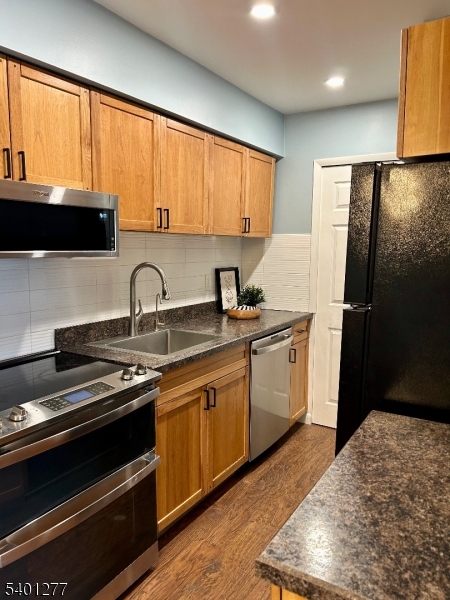 2350 State Route 10, Unit 20 Morris Plains, NJ 07950 - Photo 8 of 13 a kitchen with a sink stove and refrigerator