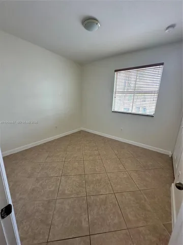 an empty room with a empty space and window