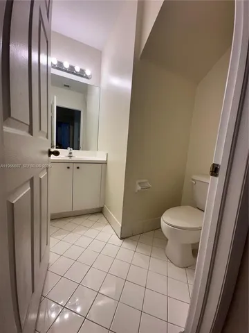 a kitchen with a stove a sink and a refrigerator