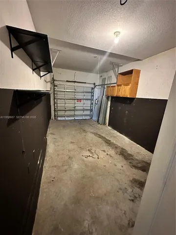 a kitchen with a refrigerator sink and stove