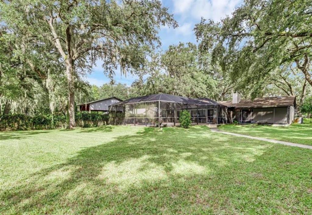 4308 Allen Road Fruitland Park, FL 34731 - Photo 32 of 33 a front view of a house with a garden