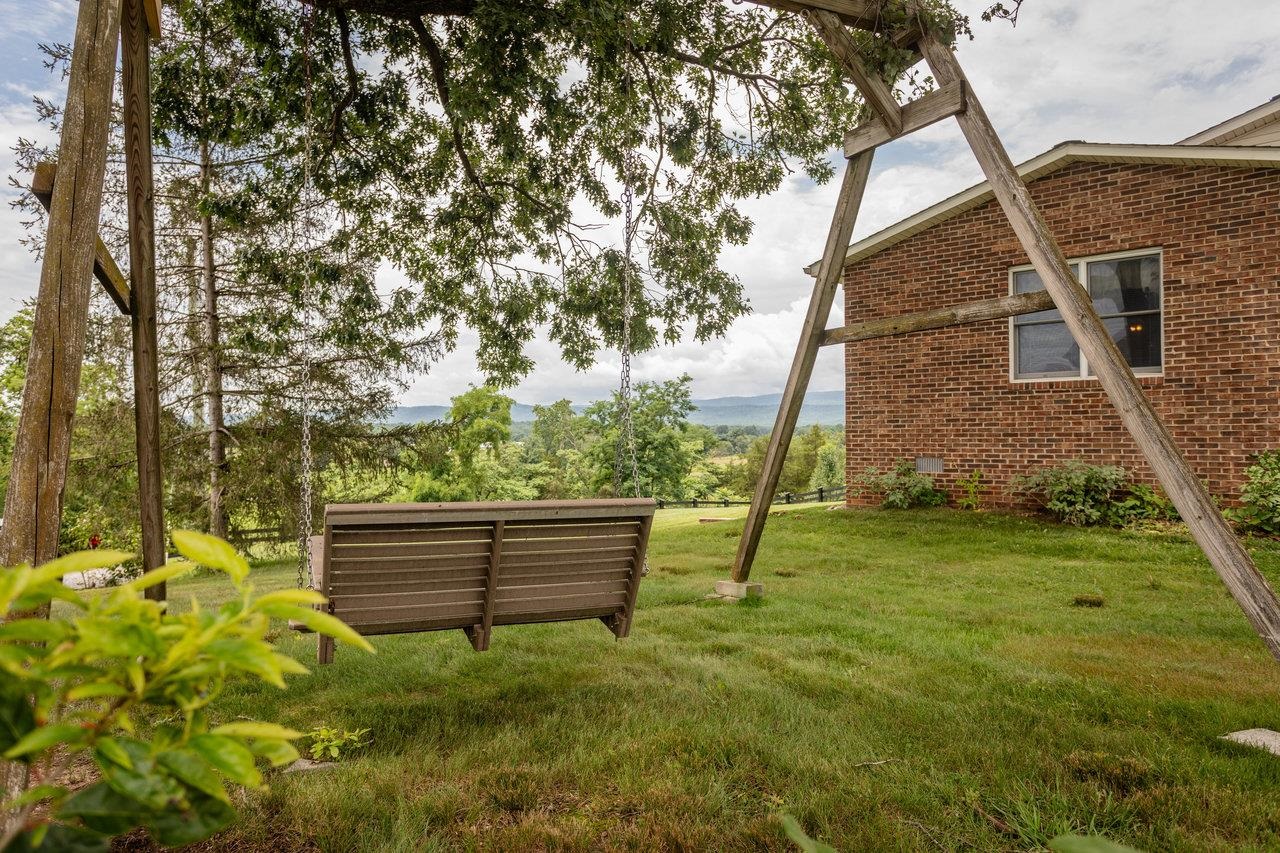 5566 Briery Branch Road Dayton, VA 22821 - Photo 67 of 75 a backyard of a house with plants and large tree