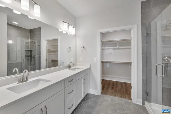 a bathroom with a double vanity sink mirror and double