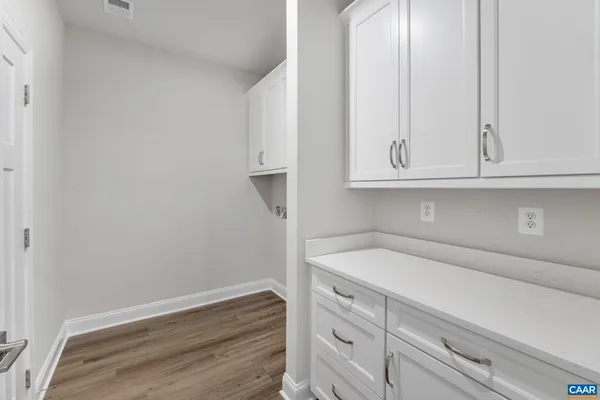 a bathroom with a sink and cabinets