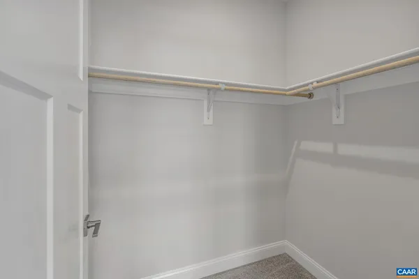 a view of a room with shelf on the wall