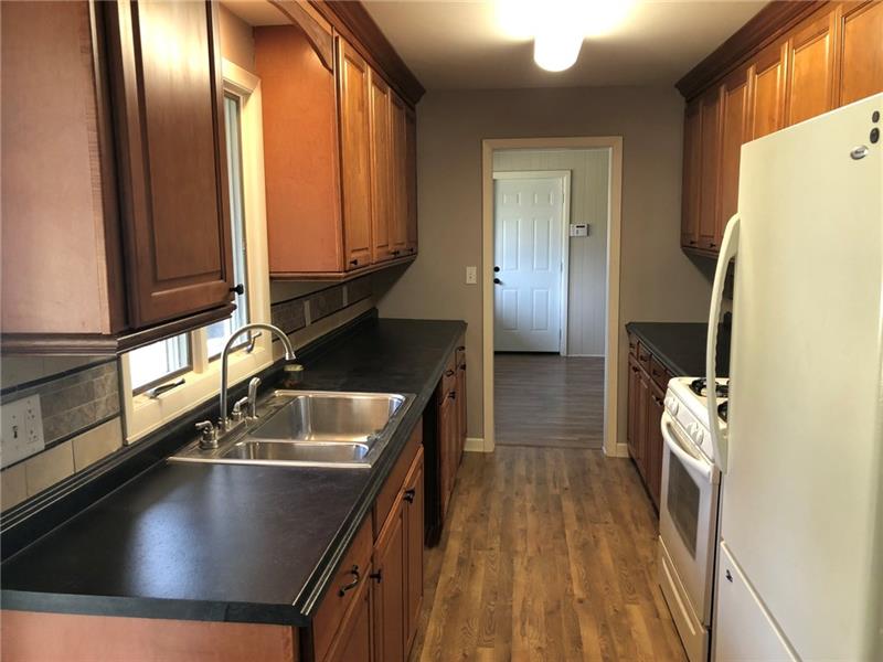 16 Ridgewood Way New Castle, PA 16105 - Photo 3 of 20 Kitchen with new counters and flooring.