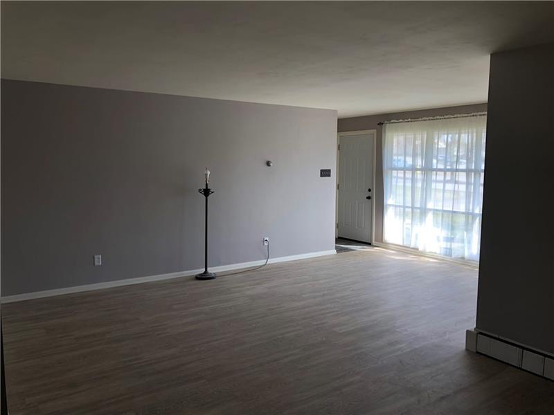 16 Ridgewood Way New Castle, PA 16105 - Photo 4 of 20 Nice size living room with new flooring.