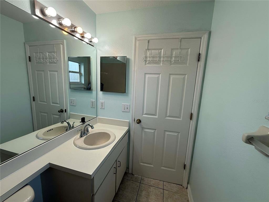 11328 Jim Court Riverview, FL 33569 - Photo 15 of 26 a bathroom with a sink vanity granite and a mirror