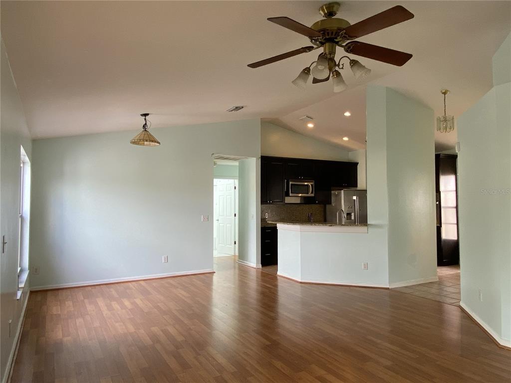 11328 Jim Court Riverview, FL 33569 - Photo 17 of 26 a view of a kitchen with a sink and a refrigerator