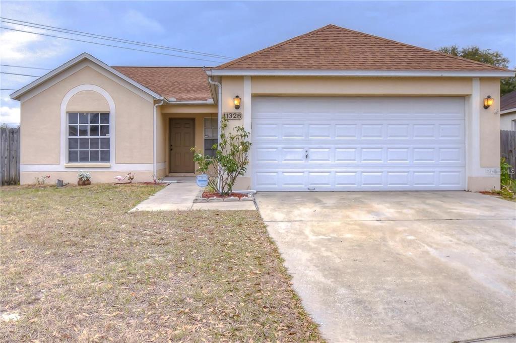 11328 Jim Court Riverview, FL 33569 - Photo 2 of 26 a front view of a house with a yard