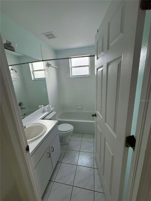 11328 Jim Court Riverview, FL 33569 - Photo 7 of 26 a bathroom with a sink a toilet and shower