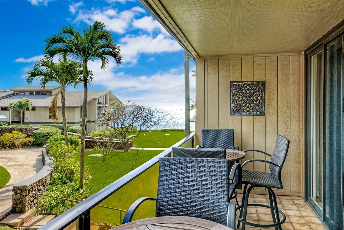 a balcony view with a potted plant