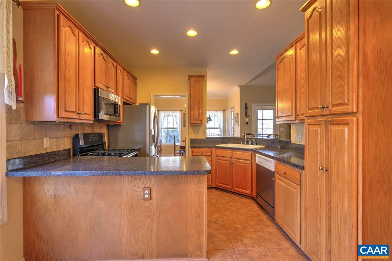 32 Zephyr Road Palmyra, VA 22963 - Photo 11 of 31 a kitchen with stainless steel appliances granite countertop a refrigerator a sink dishwasher and wooden cabinets with wooden floor